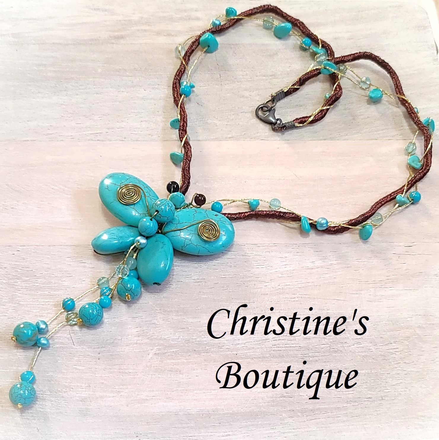 Turquoise howlite butterfly lariat on silk cording - Click Image to Close