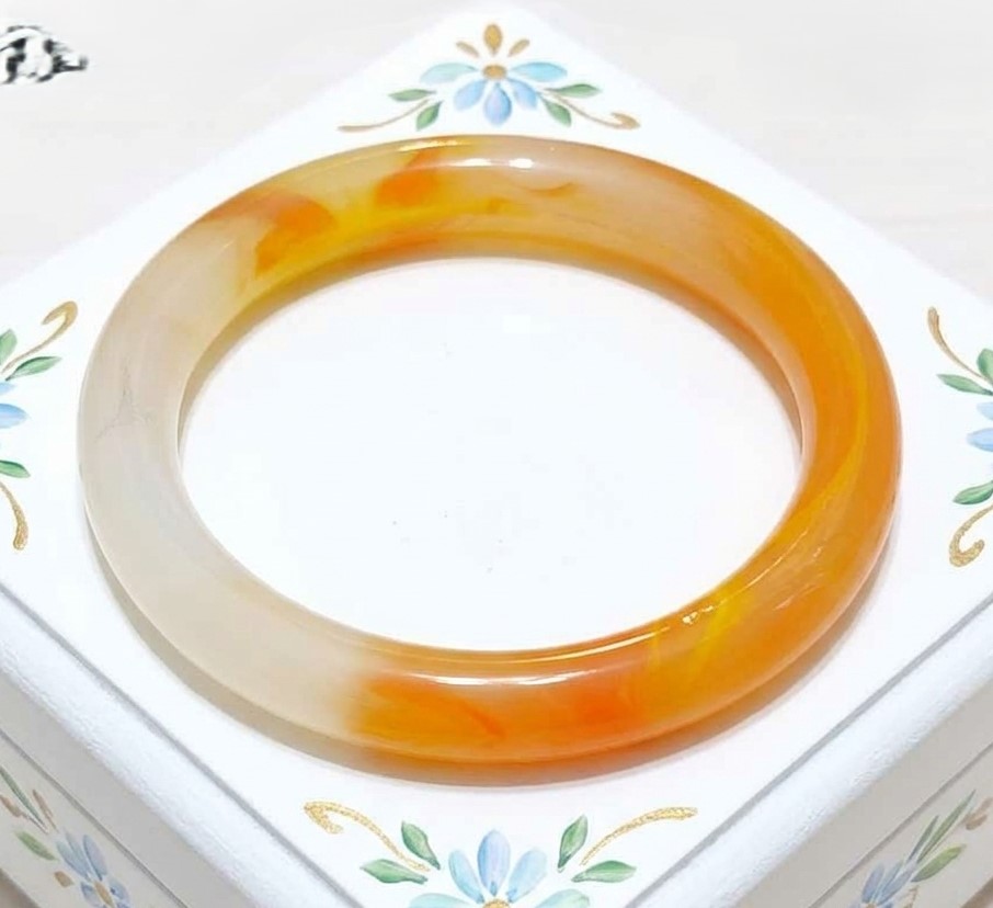 Glass bangle bracelet, vintage with iridescent orange and white swirls