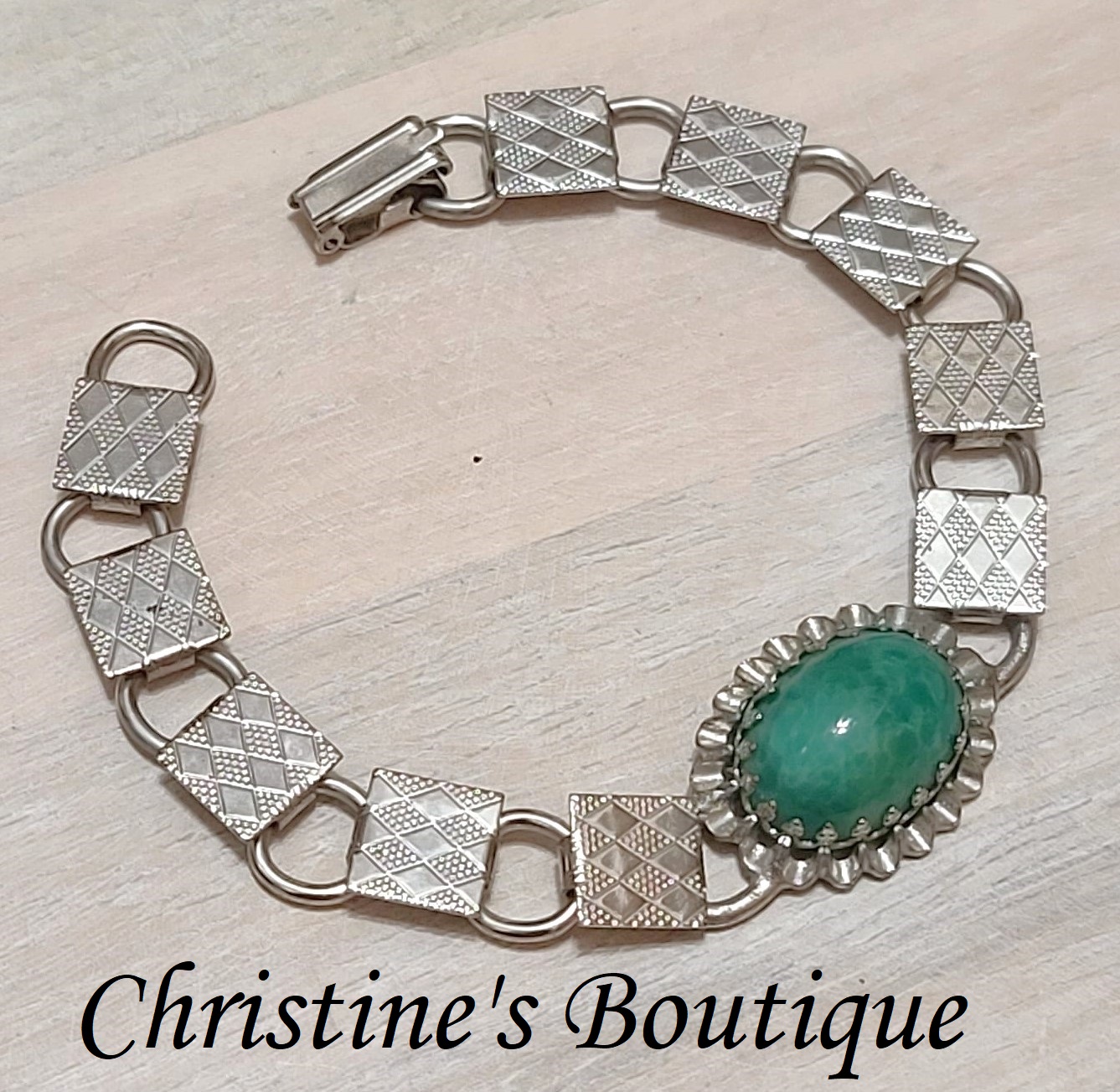 Vintage bracelet, green cabachon center, silvertone with etched detail on band