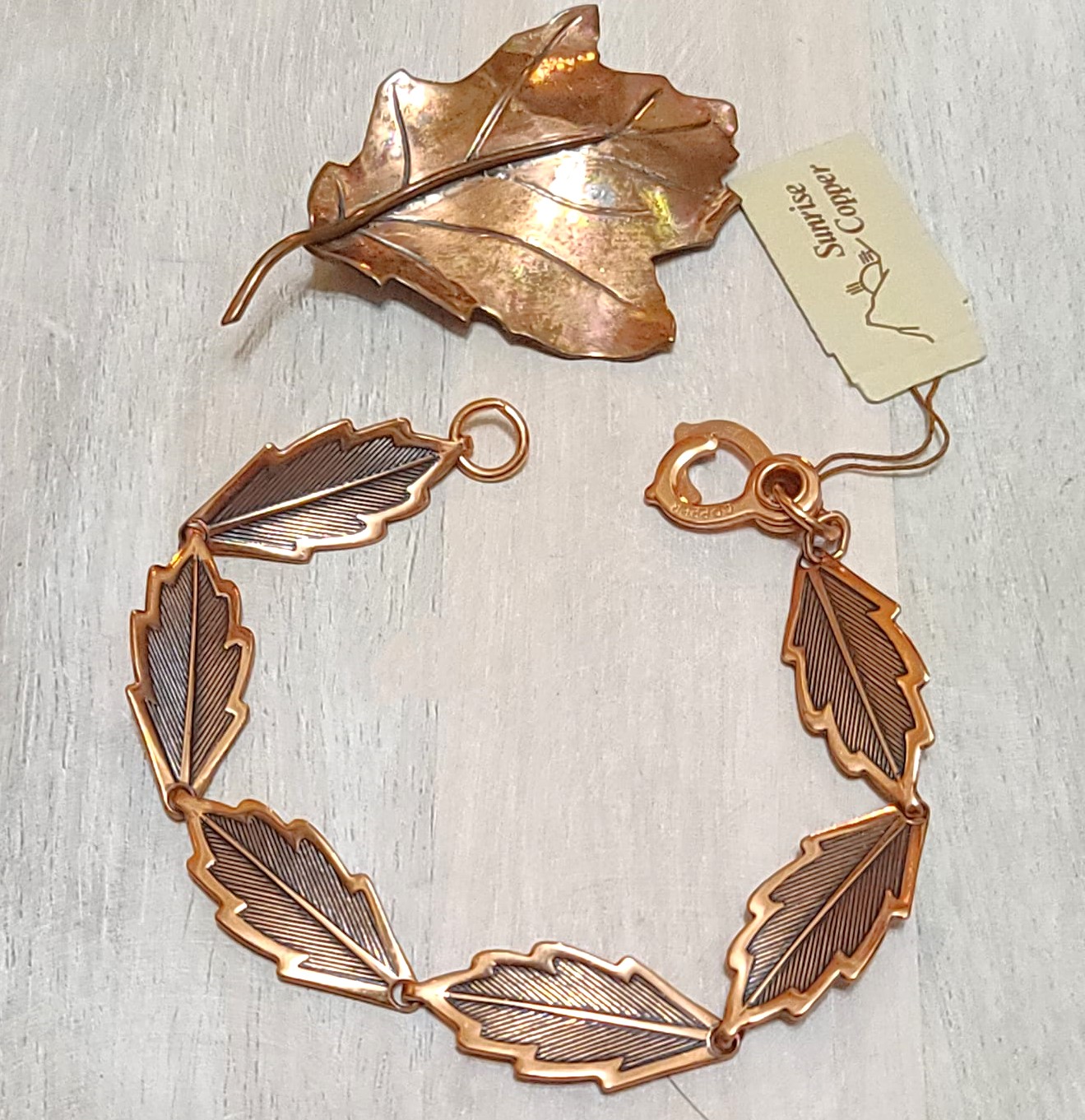 Copper leaf bracelet with matching copper maple leaf pin, vintage set, original tag