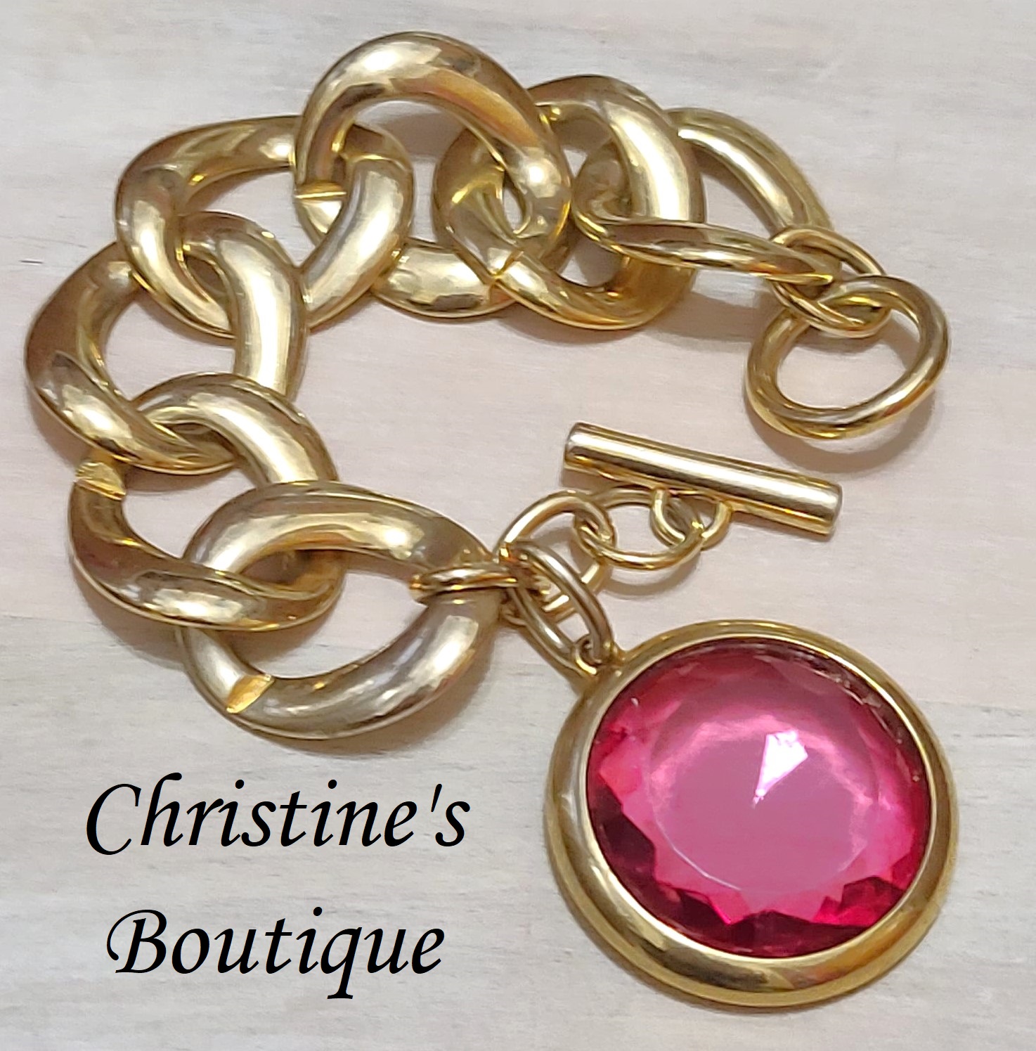 Charm bracelet, vintage, large goldtone link, with large glass pink dangle charm