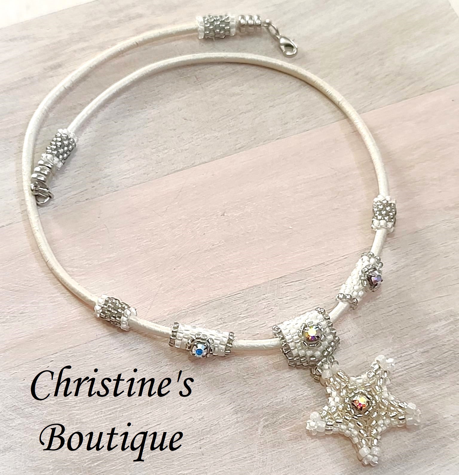 Starfish pendant necklace, w/auroa borealis crystal on leather - Click Image to Close