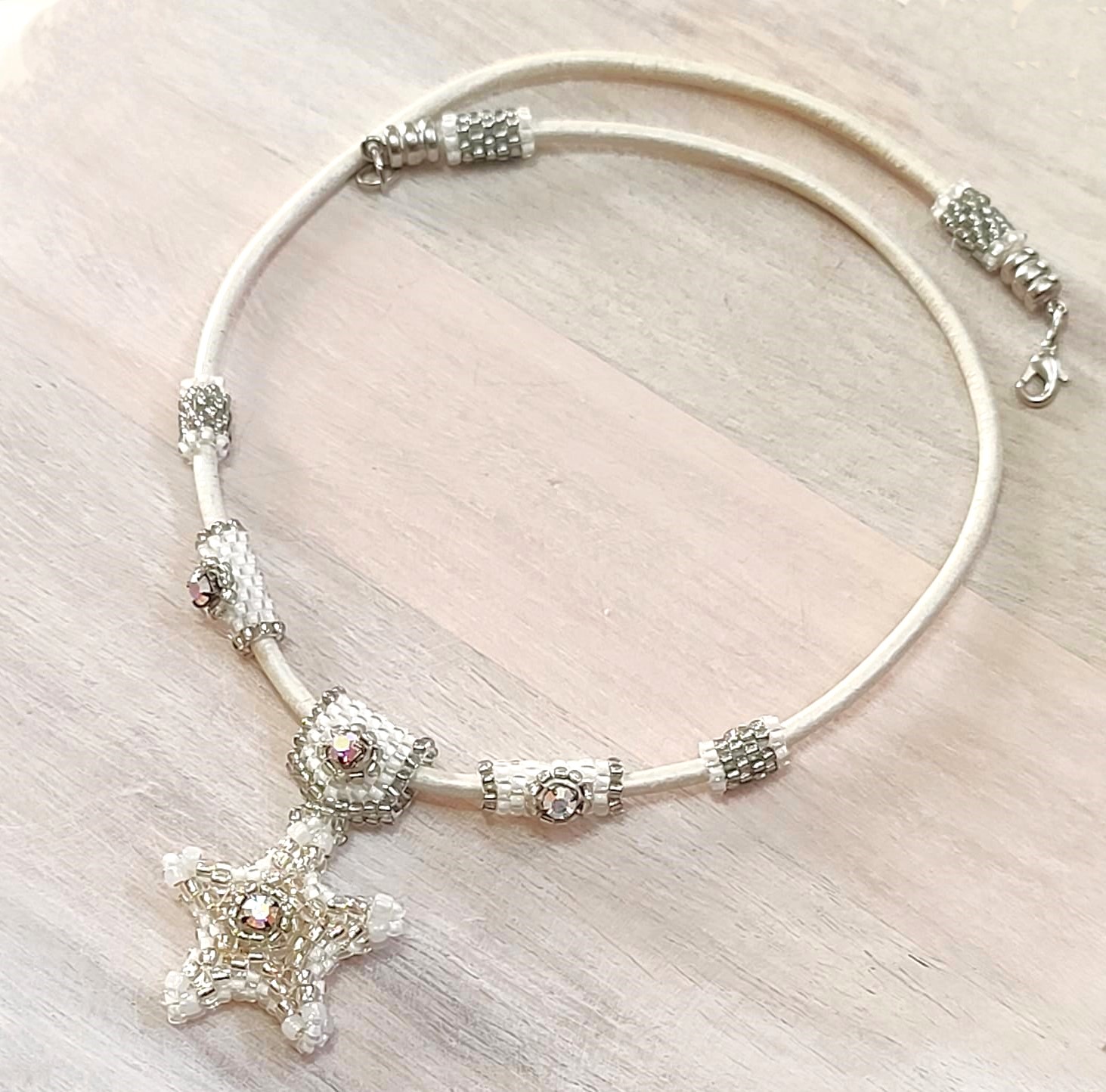 Starfish pendant necklace, w/auroa borealis crystal on leather