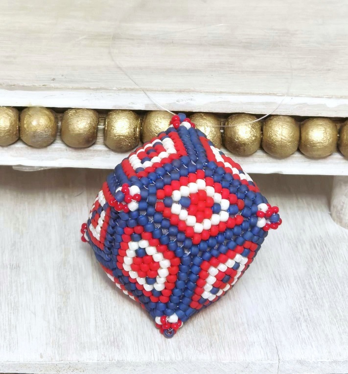 Handcrafted beaded ornament, beaded sphere shape, patriotic colors, red, white and blue