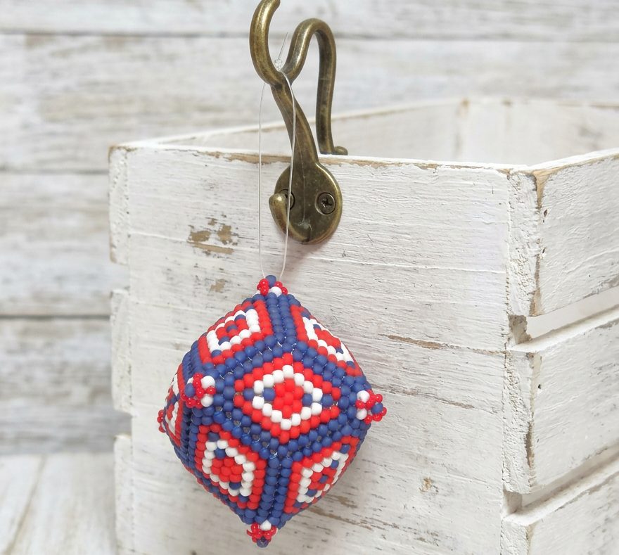 Handcrafted beaded ornament, beaded sphere shape, patriotic colors, red, white and blue