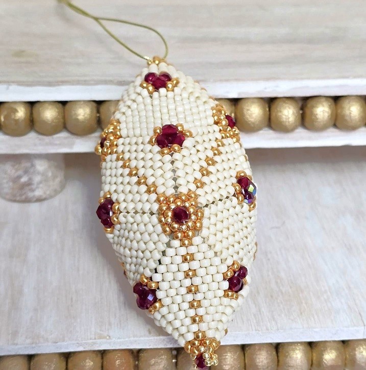 Beaded ornament, handmade, miyuki glass beads, with red czech crystal accents, oblong shape