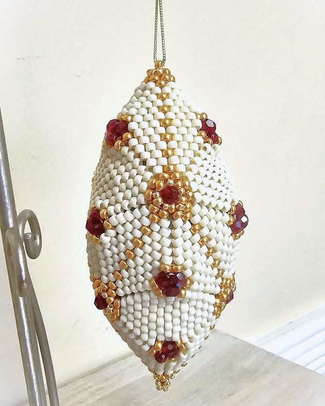 Beaded ornament, handmade, miyuki glass beads, with red czech crystal accents, oblong shape