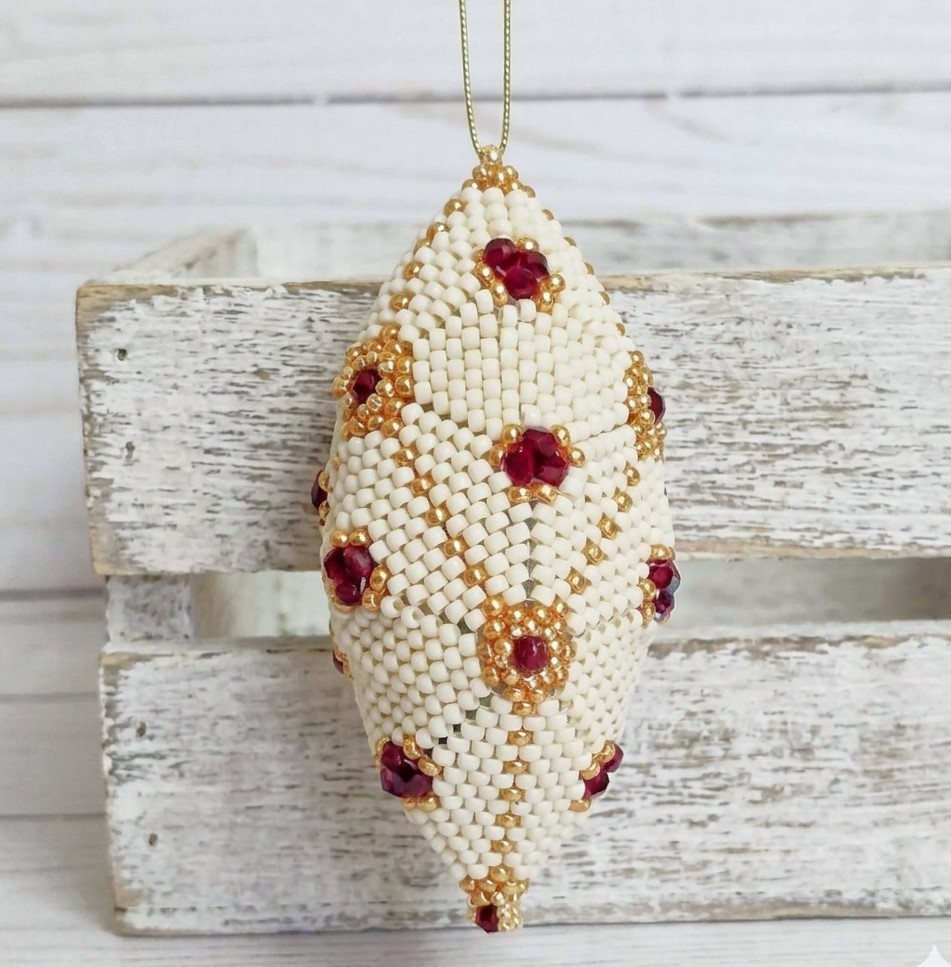 Beaded ornament, handmade, miyuki glass beads, with red czech crystal accents, oblong shape