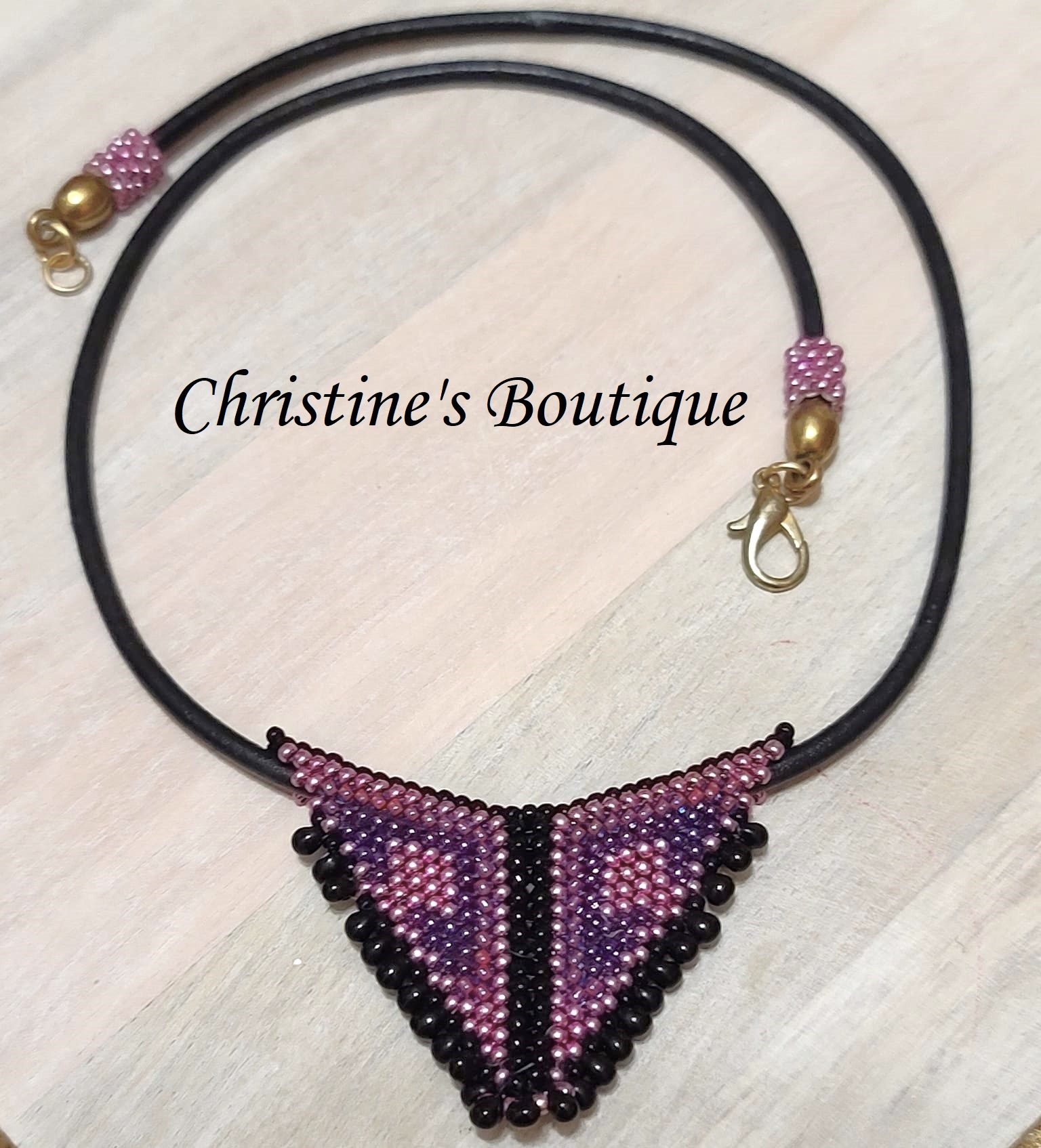 Miyuki glass beaded triangle pendant on black leather necklace