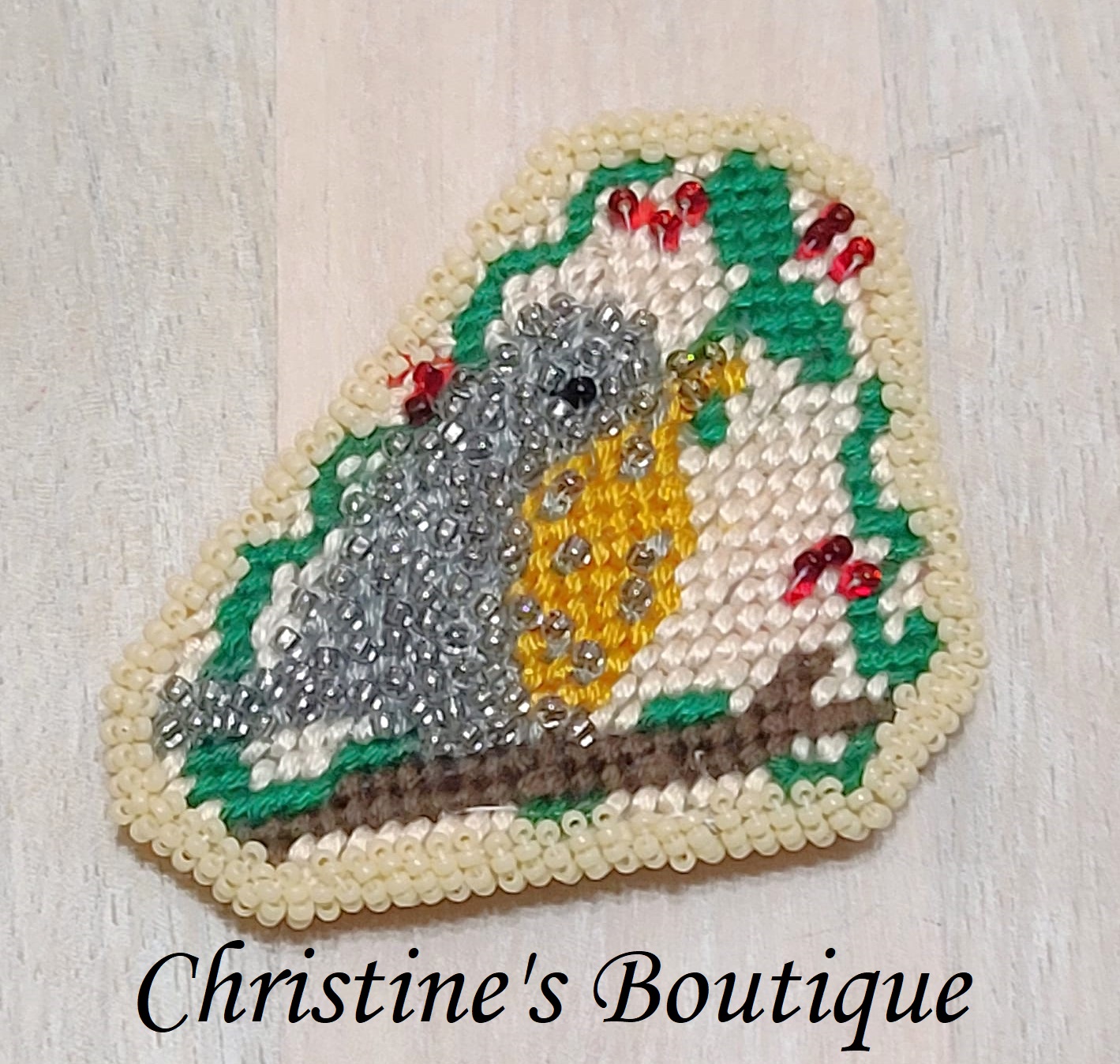 bird pin, handcrafted, bird on a branch, needlepoint and beading