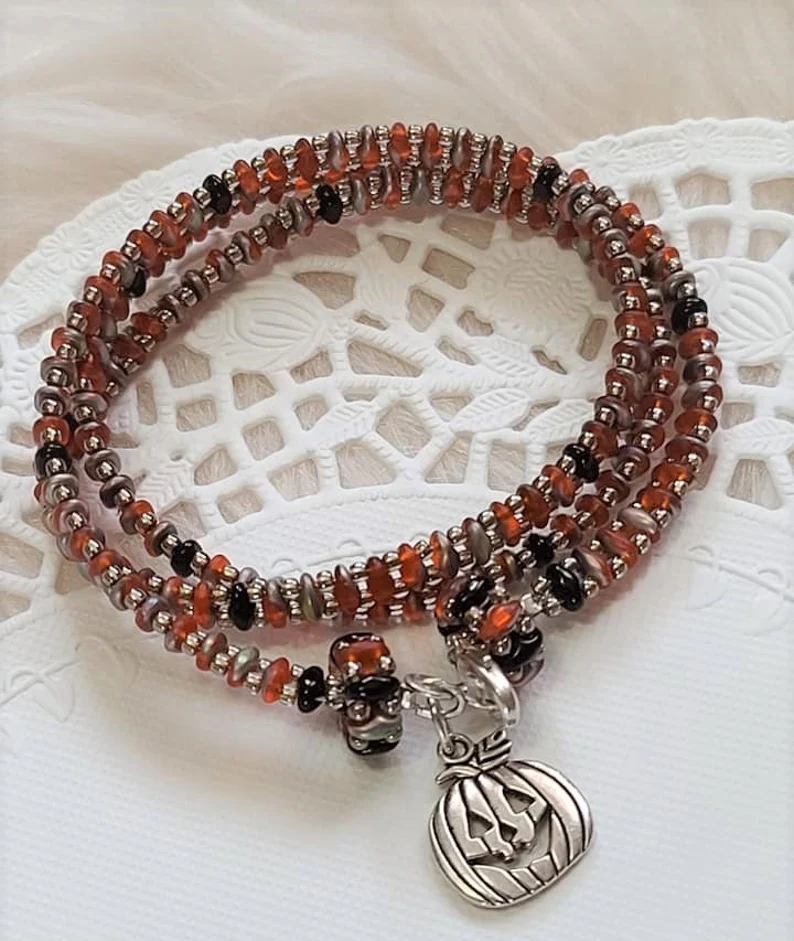 Handmade glass beaded wrap bracelet with pumpkin charm