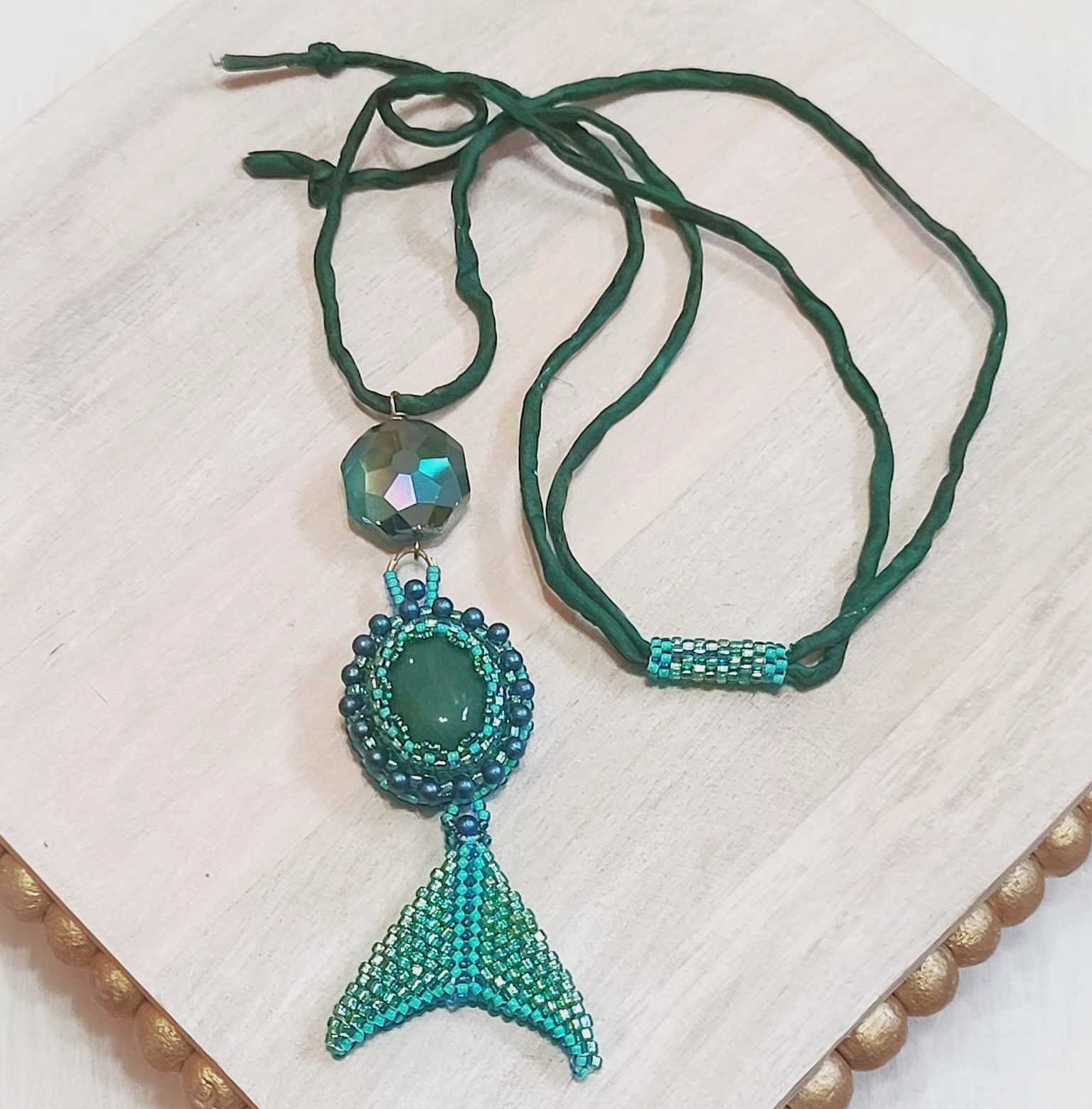 Green aventurine gemstone pendant, handcrafted on silk