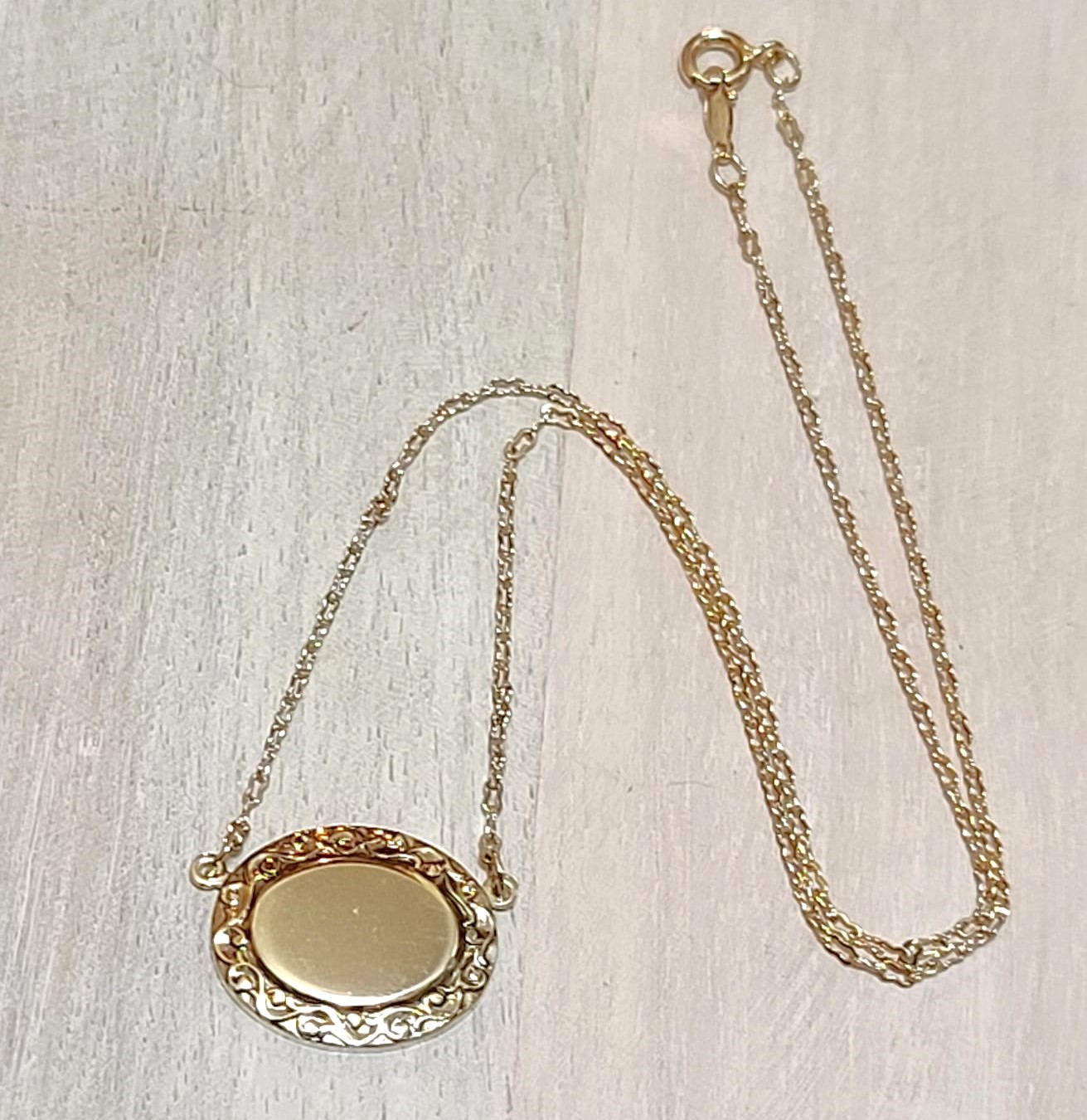 The Roman Company, RMN, oval shaped pendant and chain goldtone