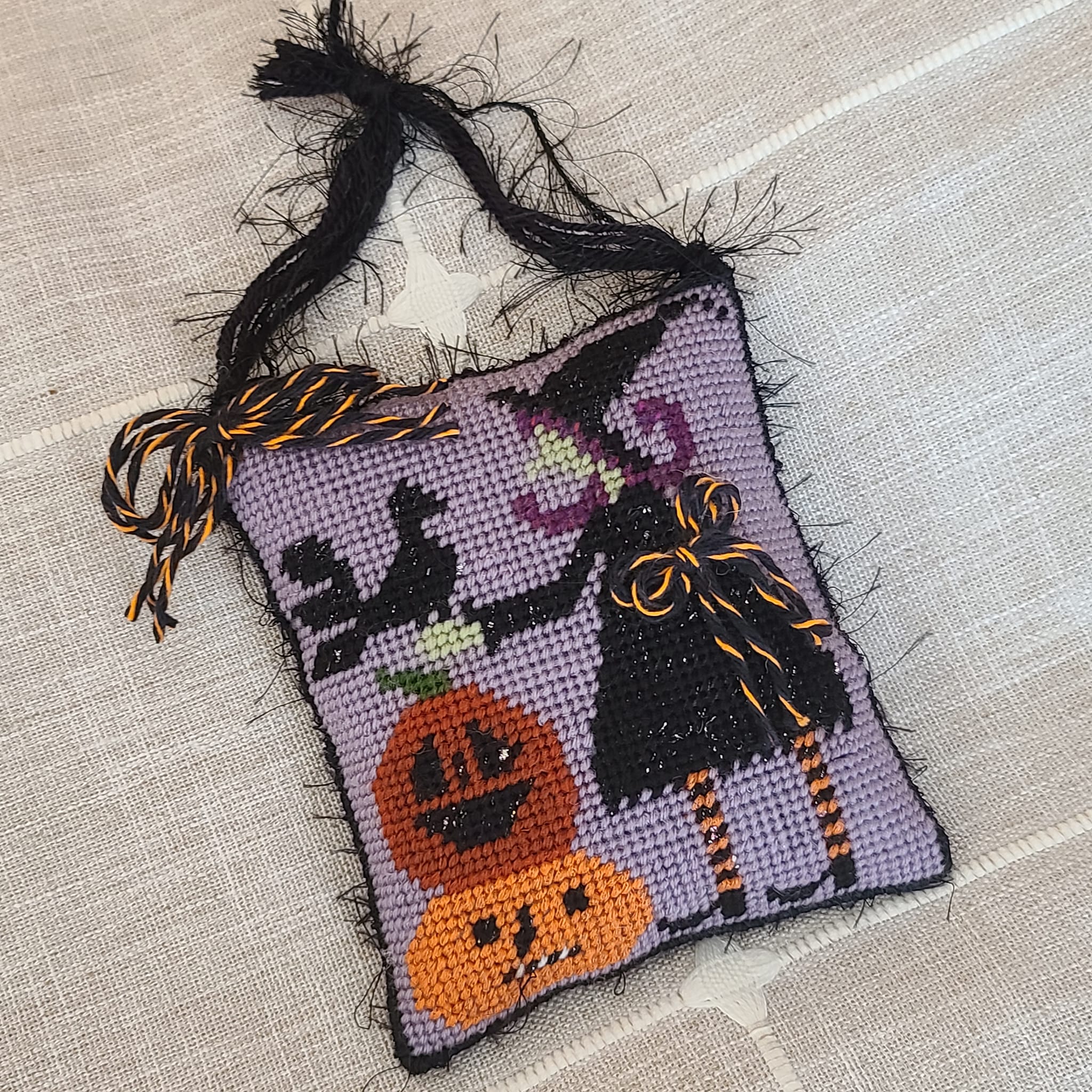 Halloween finished needlepoint witch with crow and pumpkins
