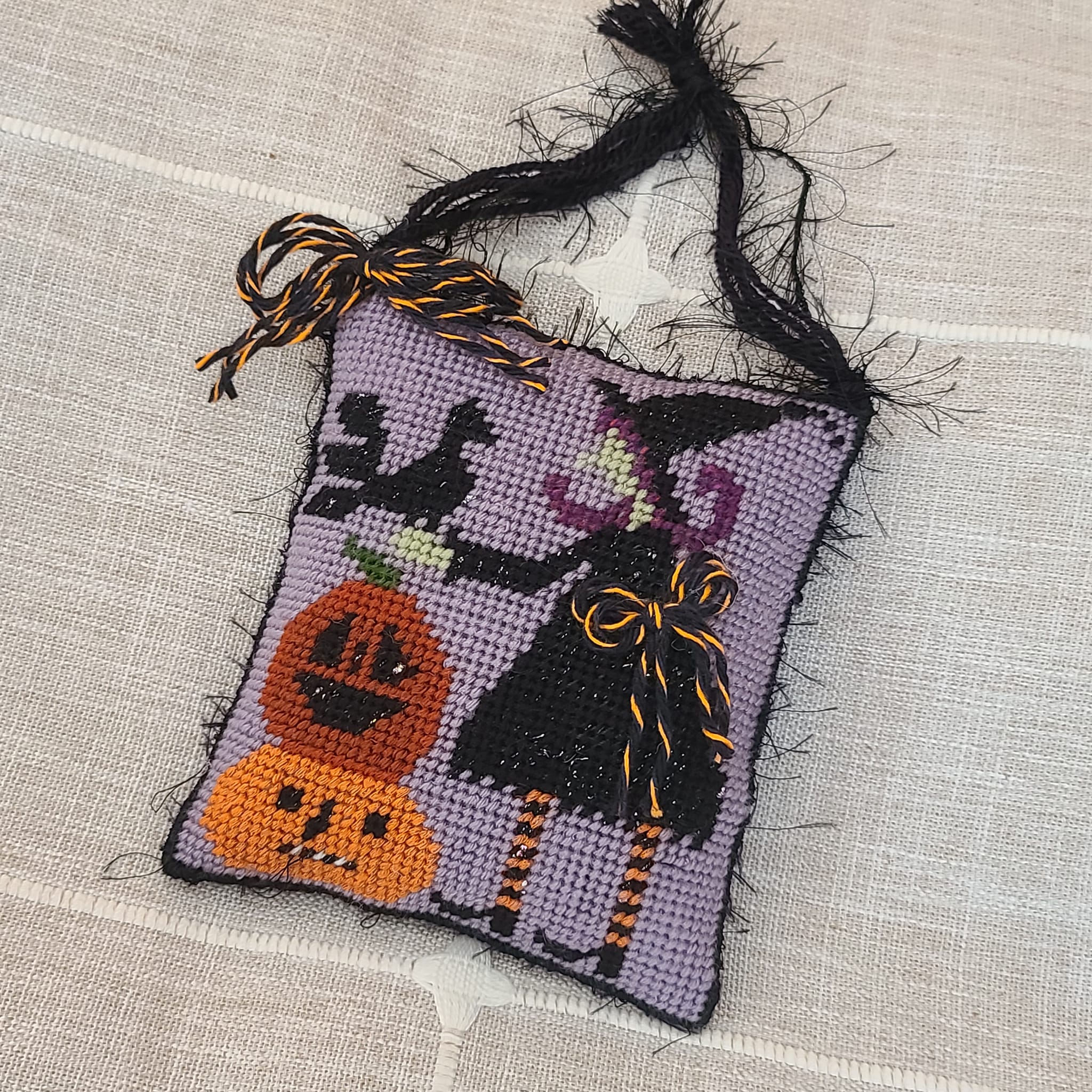 Halloween finished needlepoint witch with crow and pumpkins