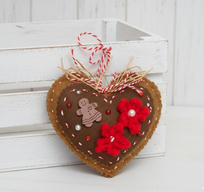 Gingerbread and chocolate icing with red accents heart ornament Gingerbread and chocolate icing with red accents heart ornament