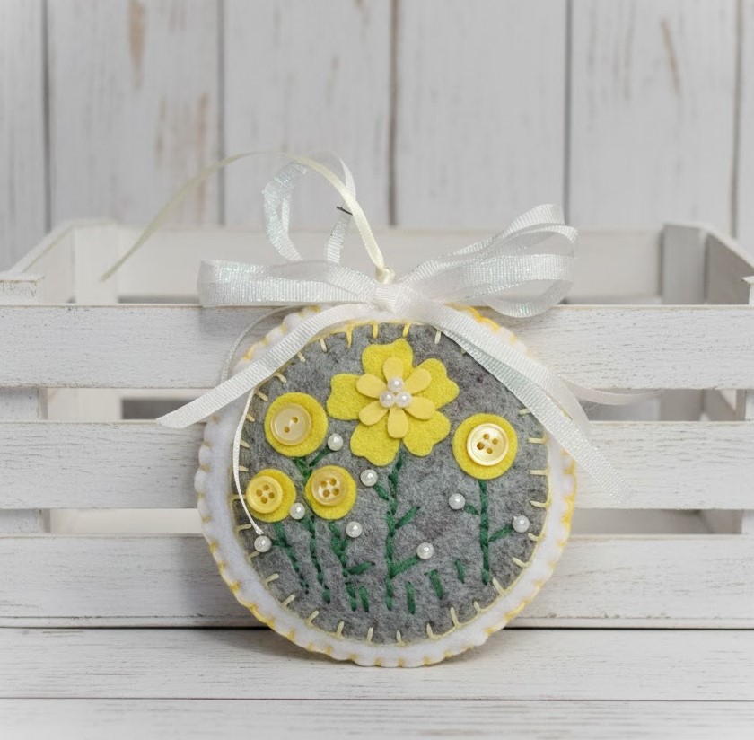 Felt embroidery round ornament w yellow flowers, buttons
