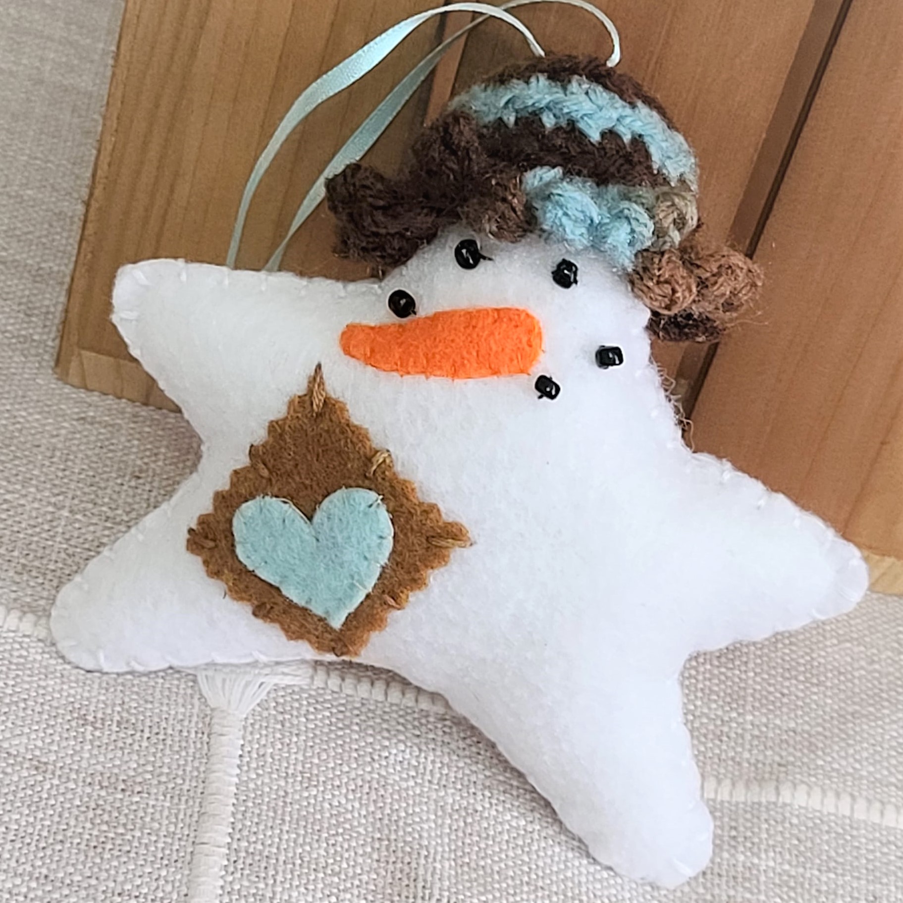 Felt Snowman star ornament with crochet hat - brown/blue hat