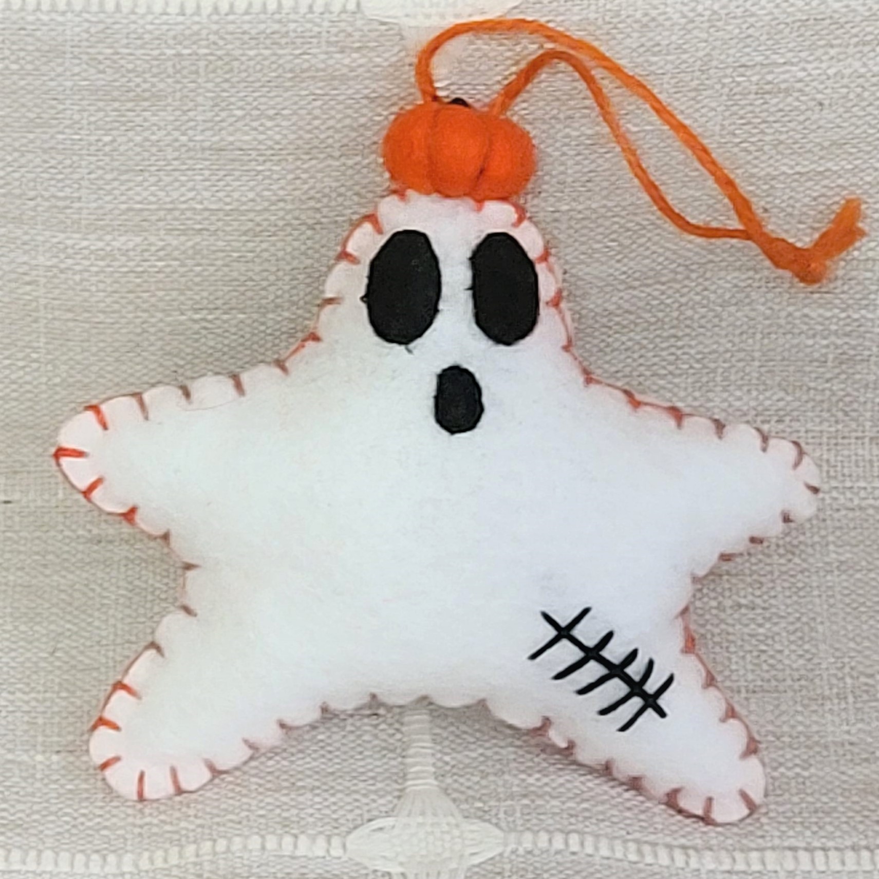 Halloween felt star ghost with pumpkin ornament - orange stitch