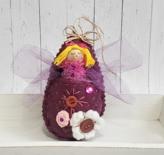 Pod babies whimsical ornament -blonde girl in mauve purple pod Pod babies whimsical ornament -blonde girl in mauve purple pod