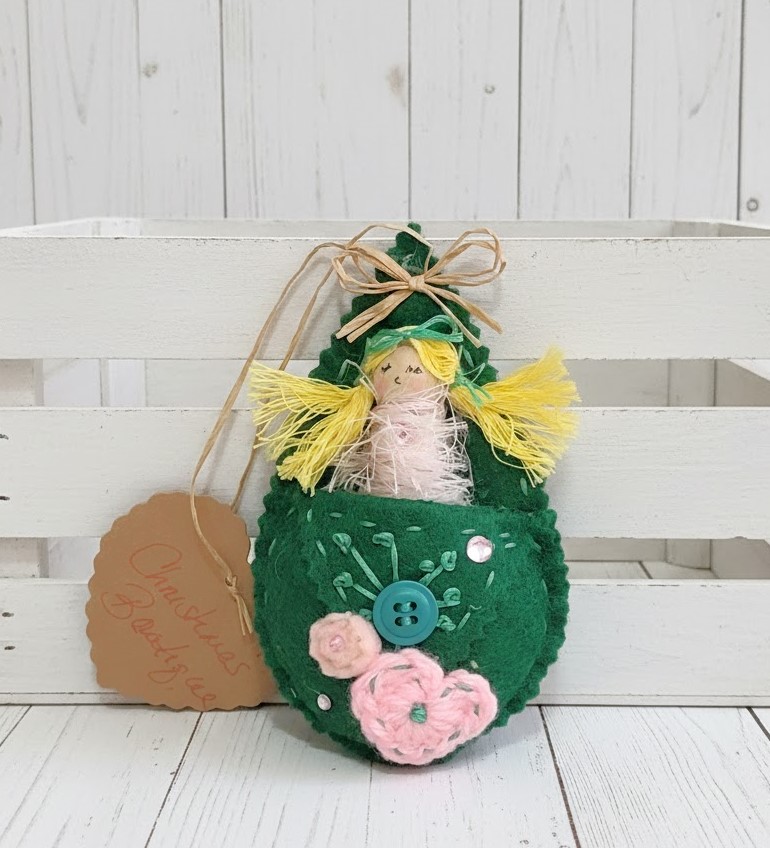 Pod babies whimsical ornament -blonde girl in pink and green pod