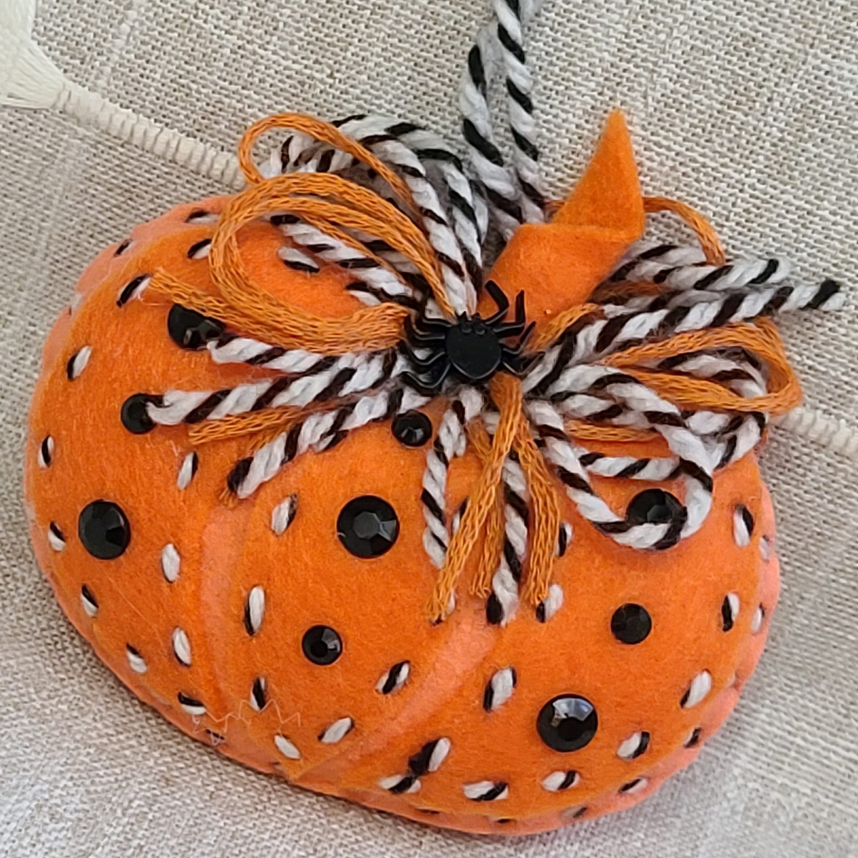 Felt pumpkin ornament - orange with black and white