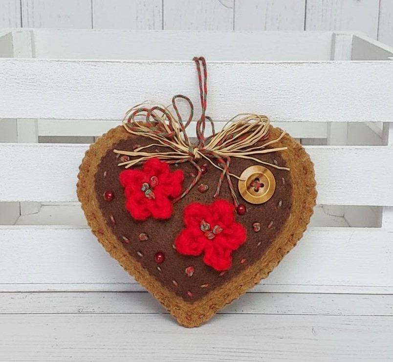 Gingerbread and chocolate icing with red accents heart ornament
