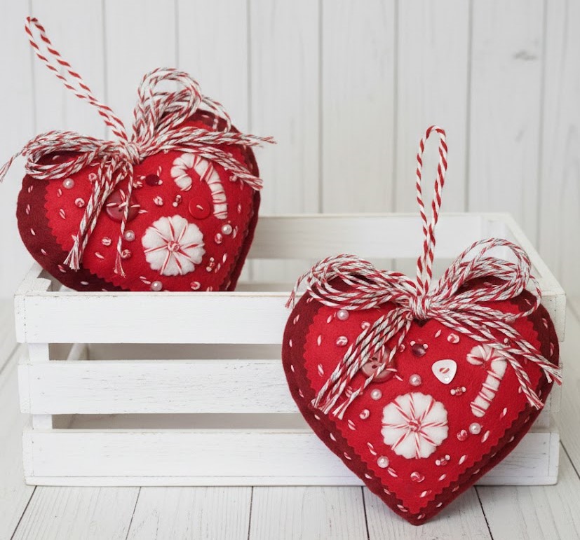 Red felt heart ornaments with embroidery and candy cane detail