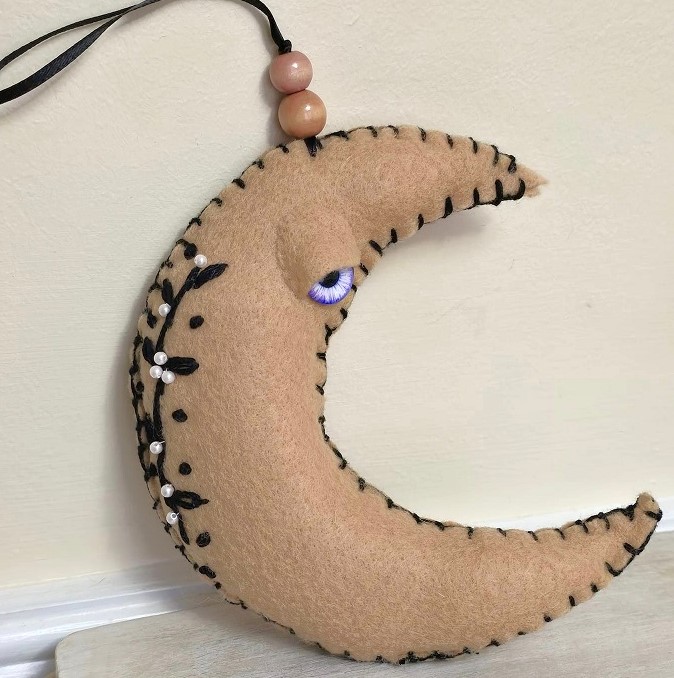 Moon ornament, beige moon with black embroidery, whimsical, handcrafted moon, felt, embroidery, bead accents