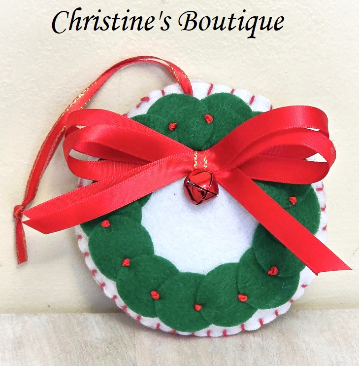 Handmade felt ornament, with green wreath deseign, red bell and ribbon