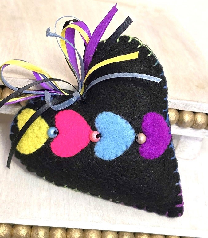 Handmade felt ornament, felt black heart with pink, blue, yellow and purple hearts, Mardi Gras ornament