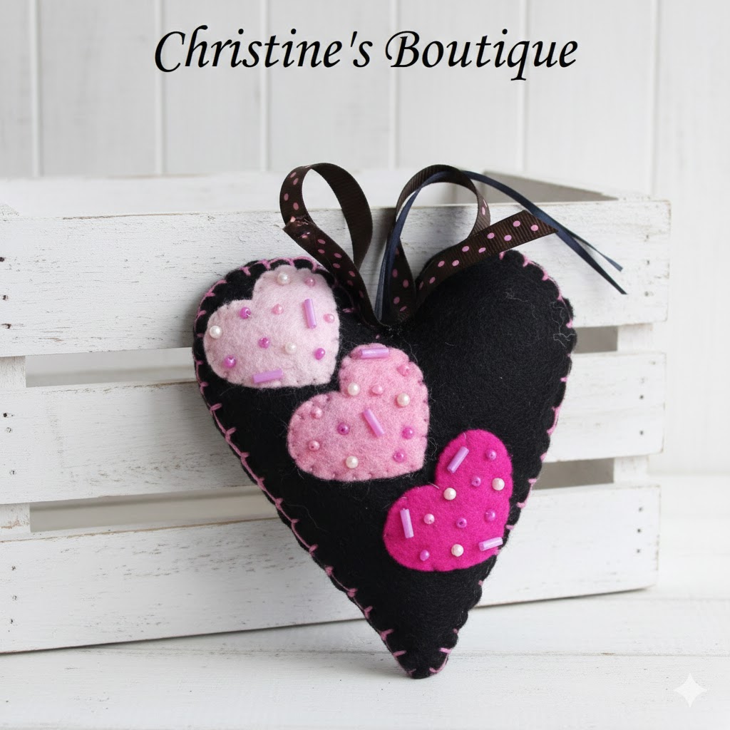 Black heart ornament with multi color pink heart applique Black heart ornament with multi color pink heart applique