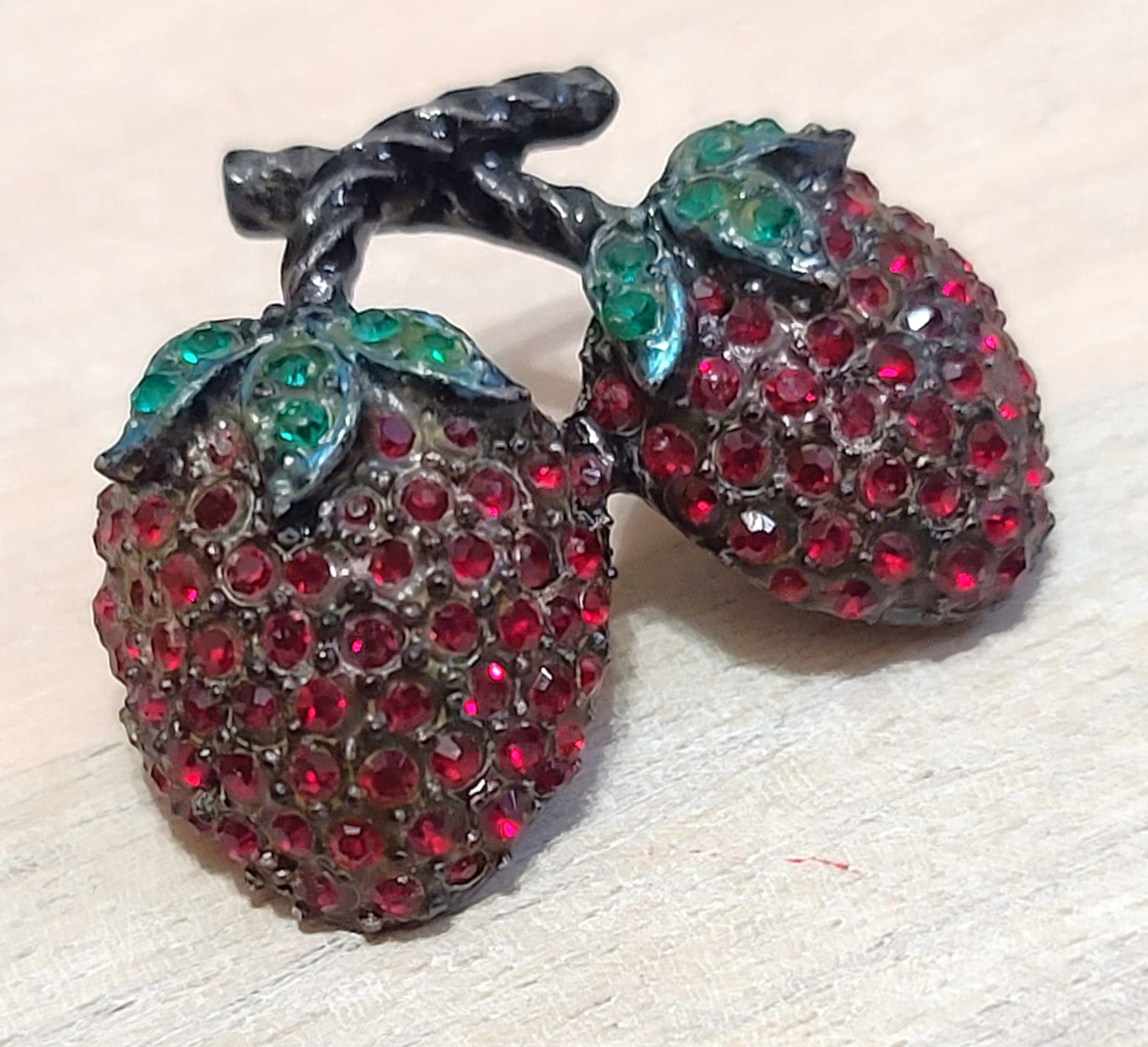 Vintage strawberry brooch, pin, dark red rhinestones, set in a black metal